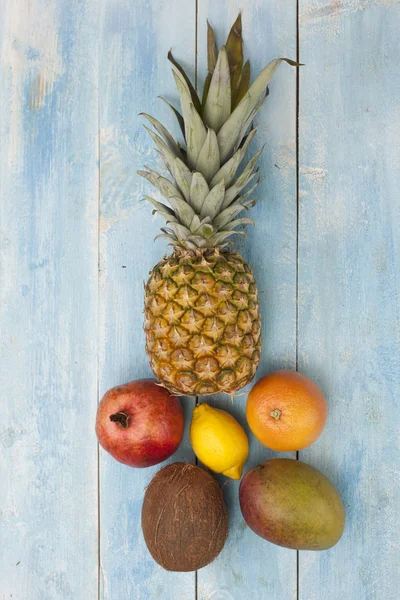 Fruits on a blue wooden board