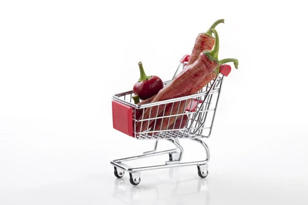 Red hot chili peppers in supermarket trolley — Stock Photo, Image