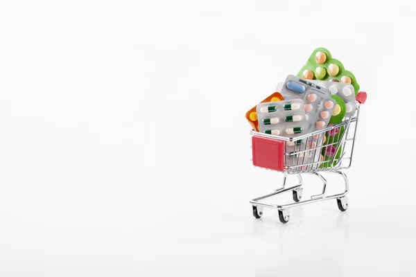 Drugs and pills in supermarket trolley — Stock Photo, Image
