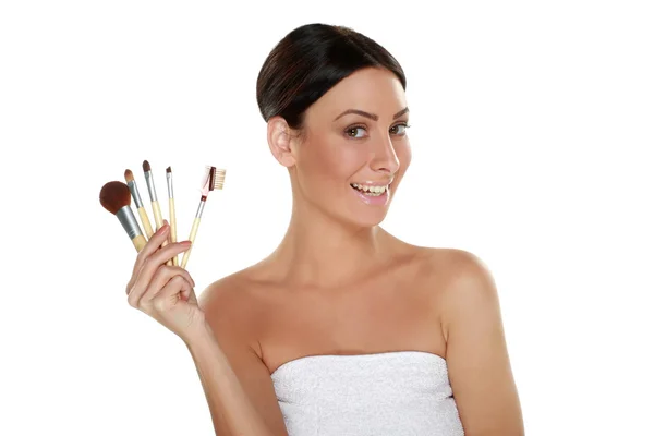 Woman holding make-up brushes — Stock Photo, Image