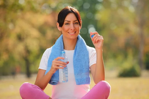 woman with bottle after fitness