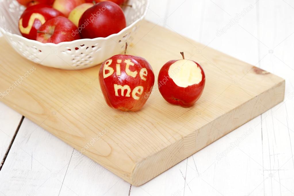 Apples with the words bite me