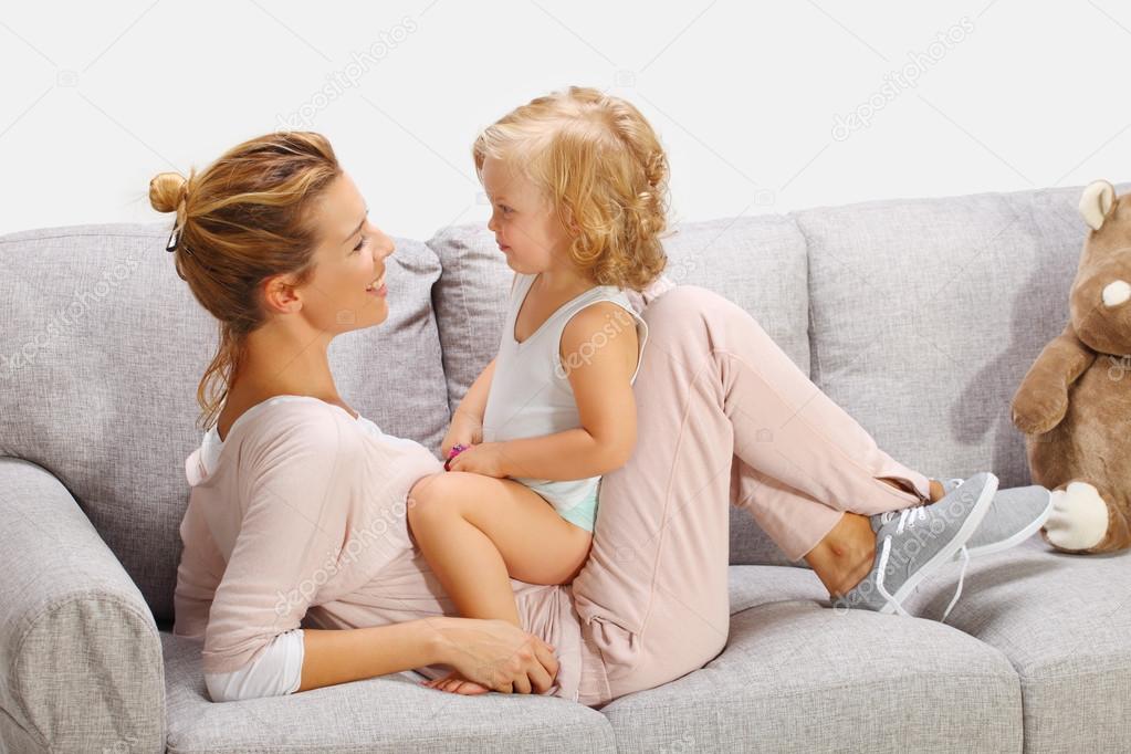 mother playing with daughter in livingroom