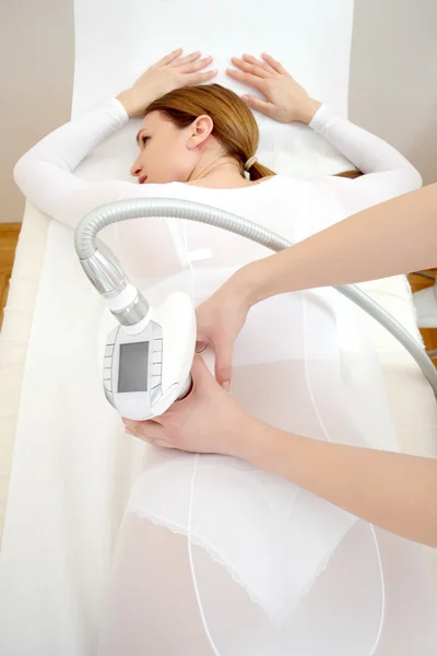 Woman having a treatment against cellulite with LPG machine — Stock Photo, Image