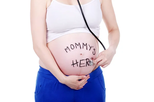 Schöne schwangere Frau mit Stethoskop — Stockfoto