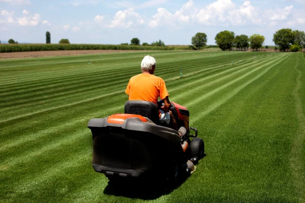 Man with lawn mower — Stock Photo, Image