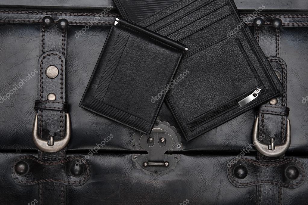 Leather wallets on the black background Stock Photo by ©likuzias 68300091