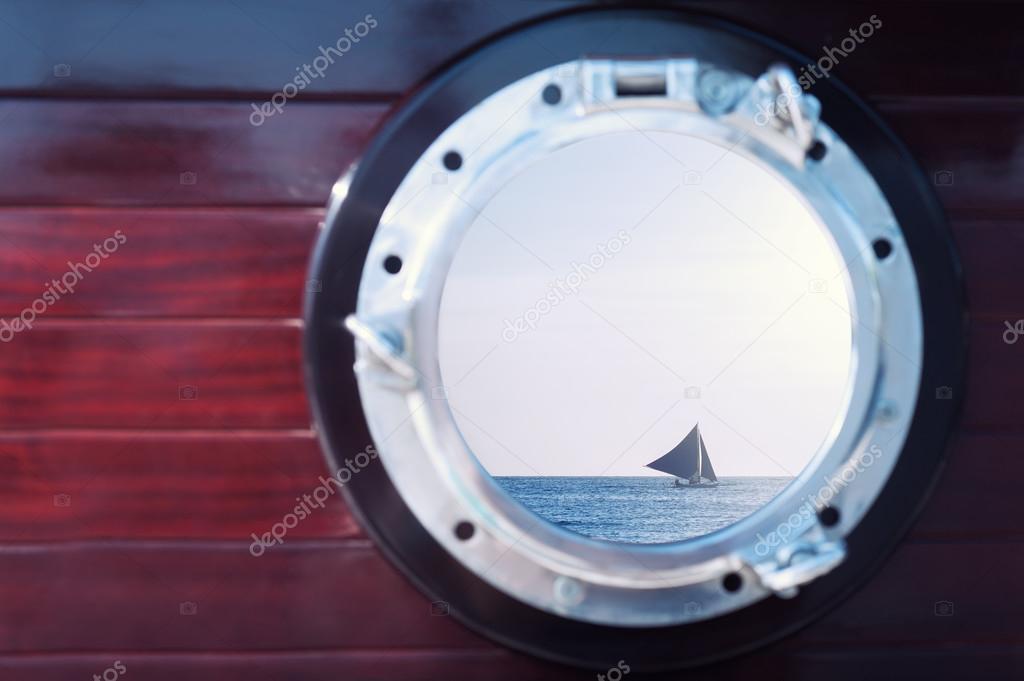 Sunset through the portholes of the boat