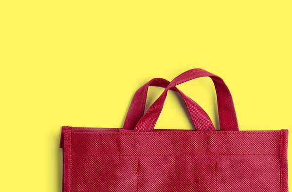 Red cotton bag on colprful background with copy space