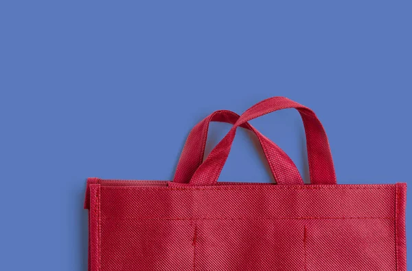 Red cotton bag on colprful background with copy space