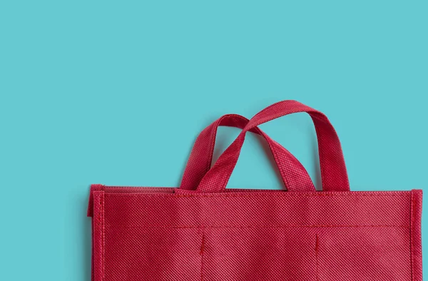 Red cotton bag on colprful background with copy space