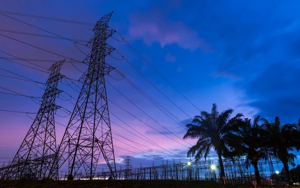 Sunset over a Silhouette electrical substation — Stock Photo, Image