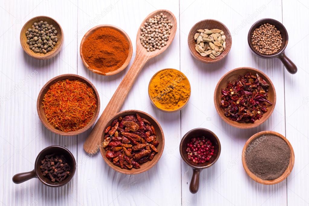 spices and herbs on wooden table.