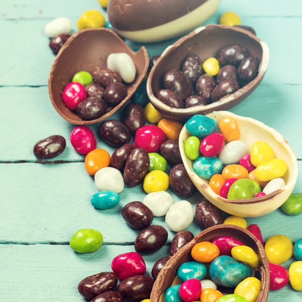 Chocolate Easter eggs and rabbit , on wooden background — Stock Photo, Image