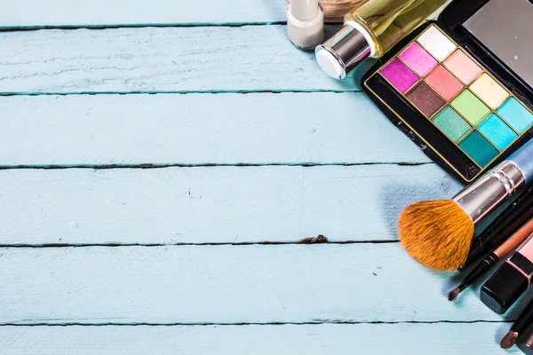 Various makeup products on dark background with copyspace — Stock Photo, Image