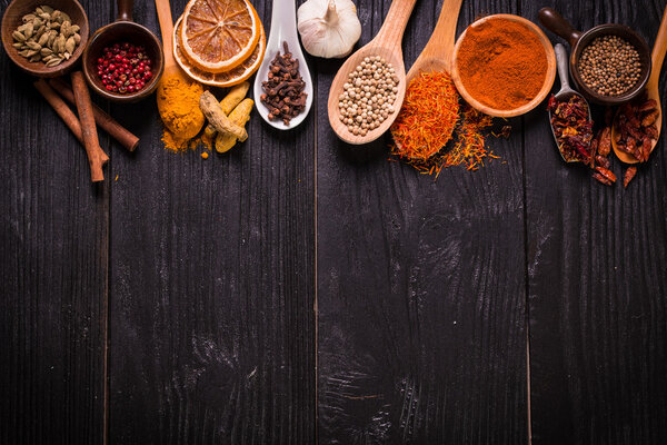 spices and herbs on wooden table , medicinal concept