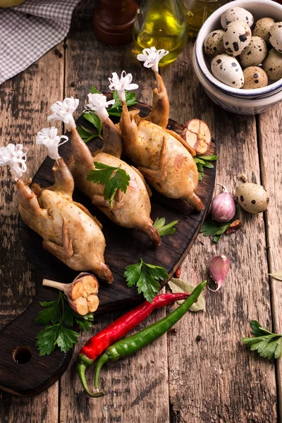 Fresh organic quails on vintage wooden table, healthy food — Stock Photo, Image