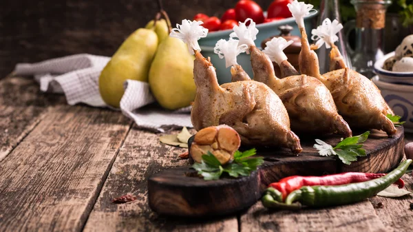 Fresh organic quails on vintage wooden table, healthy food — Stock Photo, Image