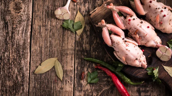 Fresh organic quails on vintage wooden table, healthy food — Stock Photo, Image