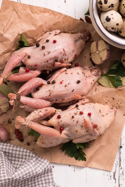 Fresh organic quails on vintage wooden table, healthy food — Stock Photo, Image