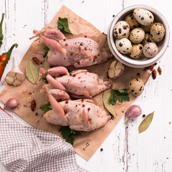 Fresh organic quails on vintage wooden table, healthy food — Stock Photo, Image