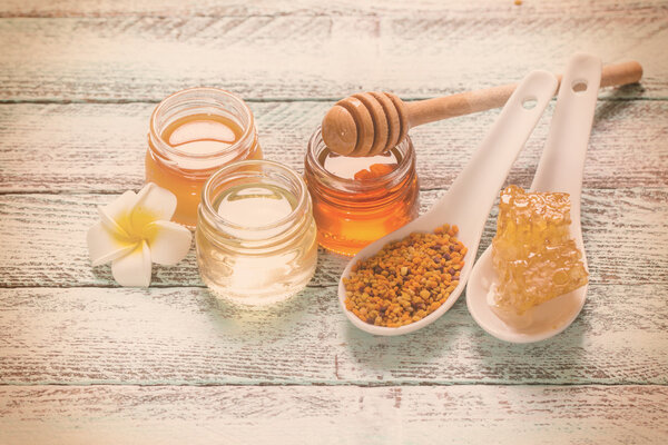 healthy honey composition, wooden background, vintage filters 