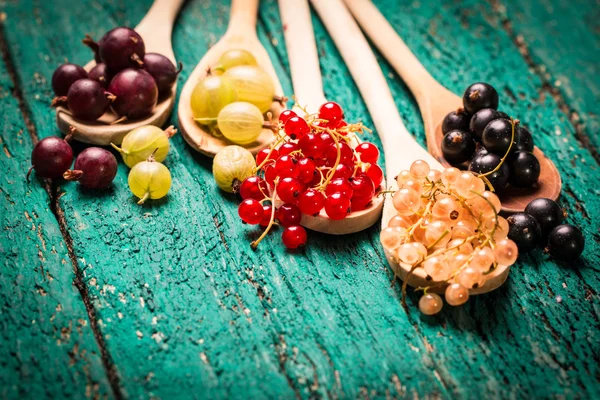 Fresh summer berries , wooden background, healthy food. Royalty Free Stock Images