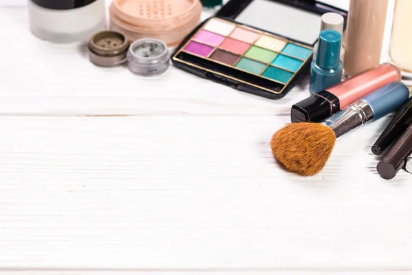 Various makeup products on dark background with copyspace — Stock Photo, Image