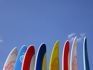 Surfboards with sky behind clipart