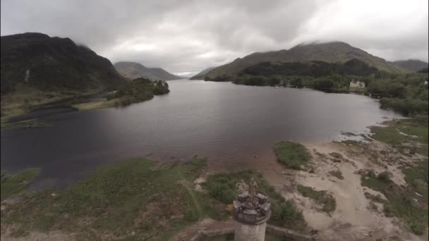 Aerial shot of the Glenfinnan Monument in the Scottish Highlands — Stock Video