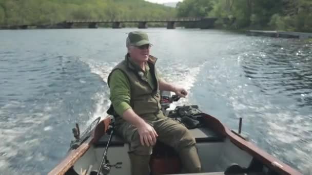 Man going fishing in small boat, Fort William, Scotland, July  2014 — Stock Video