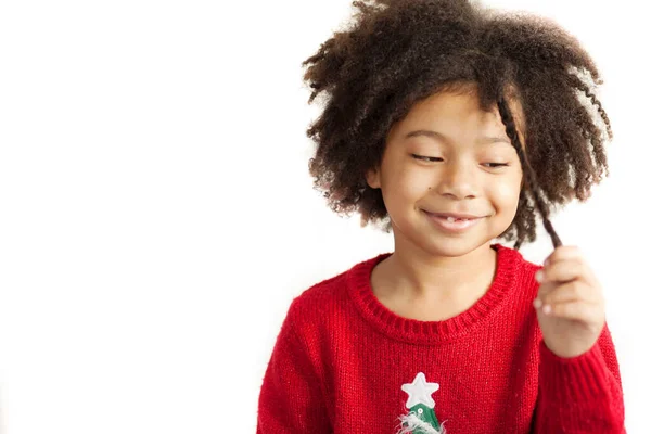 Little Girl Christmas Tree Sweater Holding Her Curl Hair — Stock Photo, Image