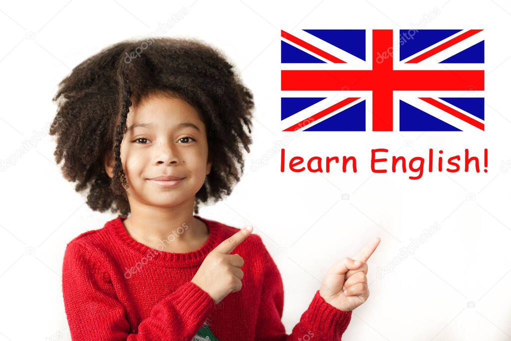 portrait of a little African American girl pointing on British flag with lettering learn English 