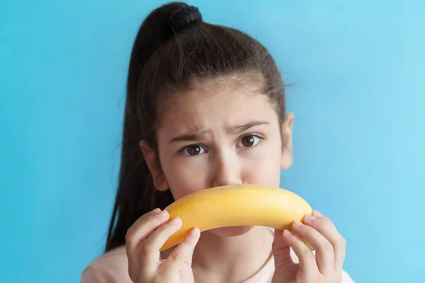 Young Girl Holding Banana Her Mouth 로열티 프리 스톡 이미지