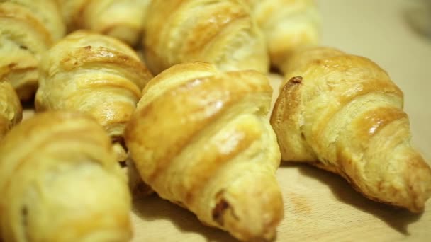 Baking croissants for breakfast — Stock Video