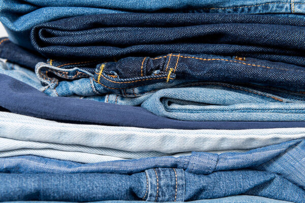 close up view of stacked blue denim garments