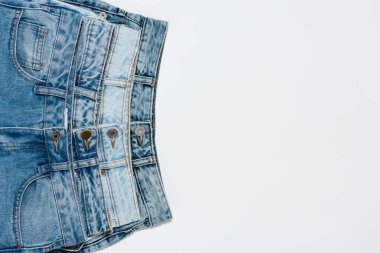 different blue jeans on white background, top view clipart