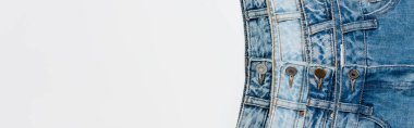 top view of various blue jeans isolated on white with copy space, banner clipart