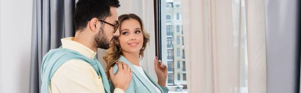 Muslim Man Hugging Smiling Girlfriend Window Hotel Room Banner — Stock Photo, Image