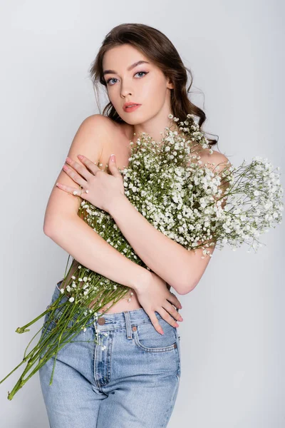 Young Woman Naked Shoulders Holding Baby Breath Flowers Isolated Grey — Stock Photo, Image