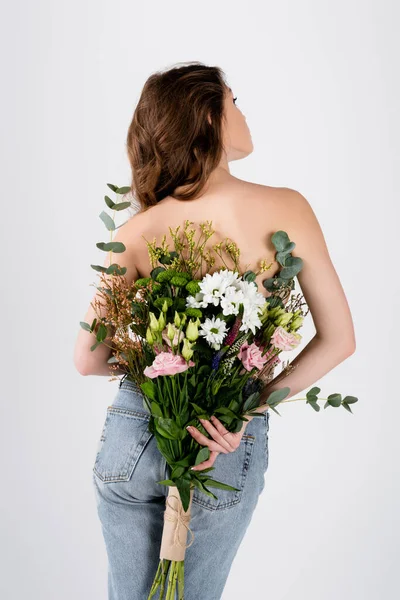 Back View Shirtless Woman Jeans Holding Flowers Isolated Grey — Stock Photo, Image