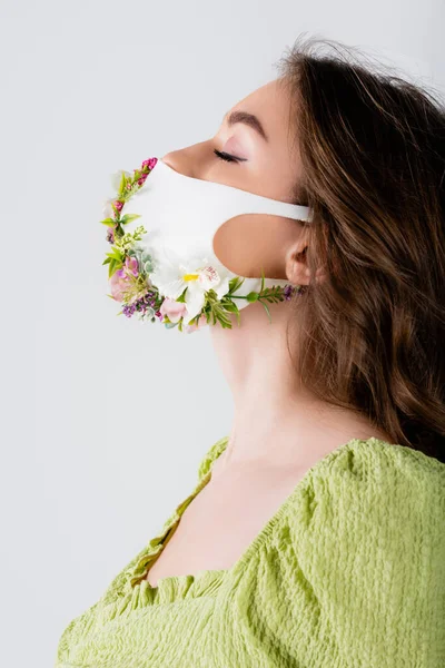 Young Woman Medical Mask Flowers Standing Closed Eyes Isolated Grey — Stock Photo, Image