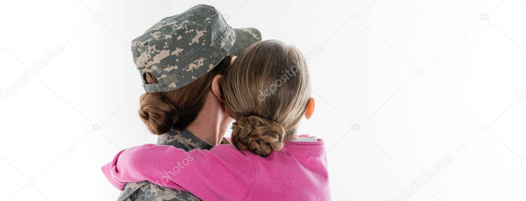 Back view of child hugging mother in camouflage isolated on white, banner 