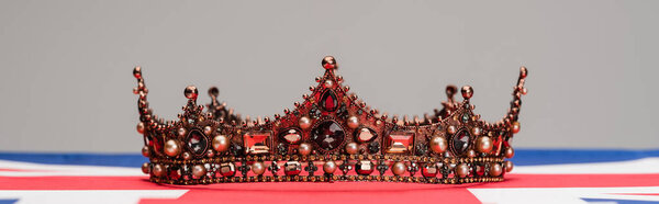 luxury royal crown on british flag isolated on grey, banner