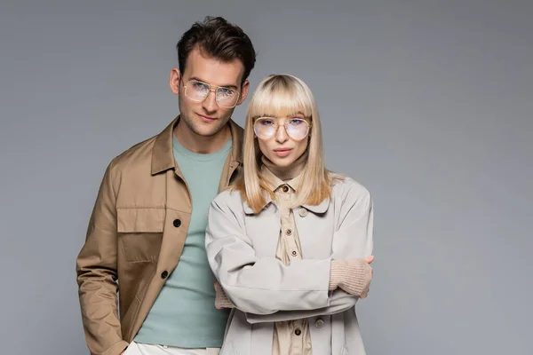 Stylish Couple Glasses Posing Looking Camera Isolated Grey — Stock Photo, Image