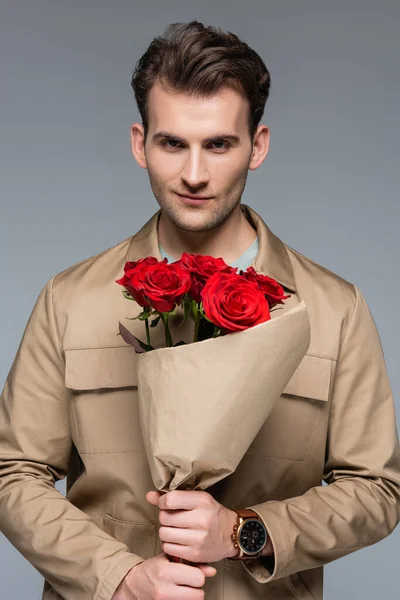 Stylish Man Holding Bouquet Red Roses Wrapped Paper Isolated Grey — Stock Photo, Image