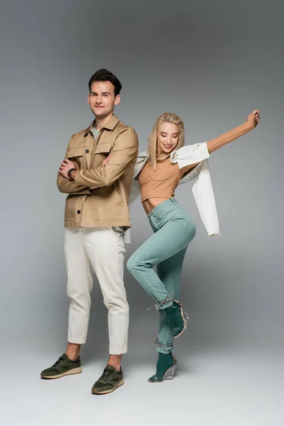 Full Length Stylish Models Pants Jackets Posing Smiling Grey — Stock Photo, Image