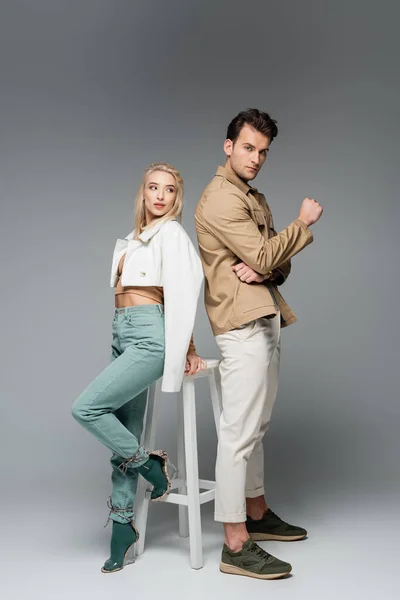 Full Length Stylish Young Models Pants Jackets Posing White Chair — Stock Photo, Image