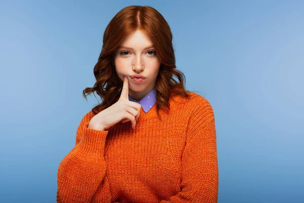 Redhead Woman Orange Sweater Puffing Cheeks Isolated Blue — Stock Photo, Image