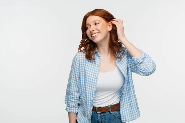 Happy Redhead Woman Plaid Shirt Adjusting Hair Isolated White — Stock Photo, Image